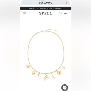 Spell Meadowland gold charm necklace.   New in plastic wrap.